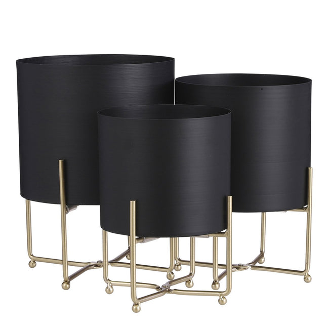 Lunar Noir Aries – zwarte metalen planters op gouden standaards